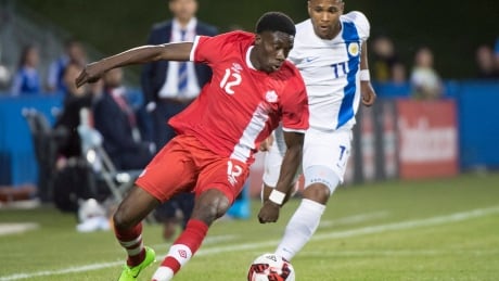 Sixteen-year-old Alphonso Davies, left, escapes Curacao's Gevaro Nepomuceno in his international debut Tuesday in Montreal. SOC Curacao Canada 20170613