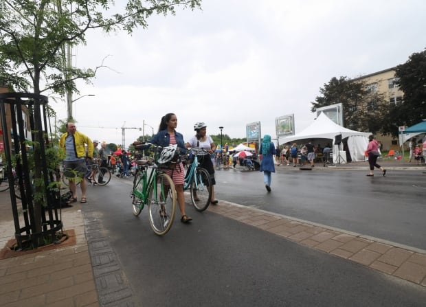 main street reopens complete street cyclists bike path ottawa