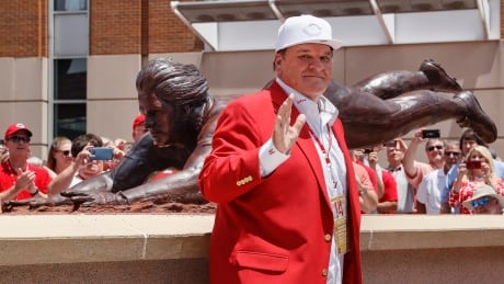 Former Cincinnati Reds player Pete Rose smiles as he stands for pictures during the dedication of his statue outside Great American Ballpark on Saturday. Dodgers Reds Baseball
