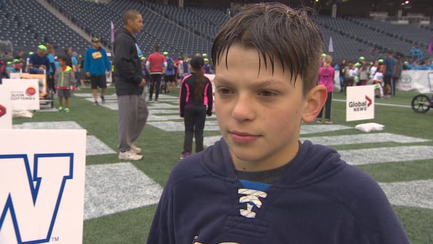 Théo Roy, 11, did the SuperRun in his wheelchair.