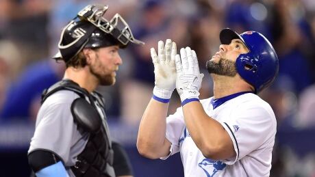 Toronto Blue Jays designated hitter Kendrys Morales celebrates his two-run home run as Chicago White Sox catcher Kevan Smith looks on during the seventh inning in Toronto on Sunday. morales-kendrys-061817-620