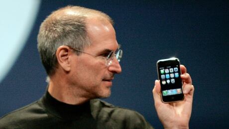 Apple Computer Inc. Chief Executive Officer Steve Jobs holds the new iPhone in San Francisco, California January 9, 2007. Apple unveiled an eagerly-anticipated iPod mobile phone with a touch-screen on Tuesday, priced at $599 for 8 gigabytes of memory, pushing the company's shares up as much as 8.5 percent. Jobs said the iPhone, which also will be available in a 4-gigabyte model for $499, will ship in June in the United States. The phones will be available in Europe in the fourth quarter and in Asia in 2008. Steve Jobs at iPhone Launch in 2007