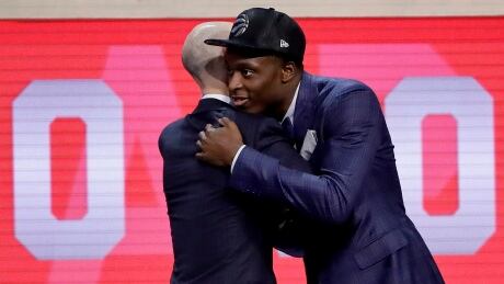 Indiana's OG Anunoby, right, is greeted by NBA Commissioner Adam Silver after being selected by the Toronto Raptors as the 23rd pick overall in the NBA draft. og-anunoby