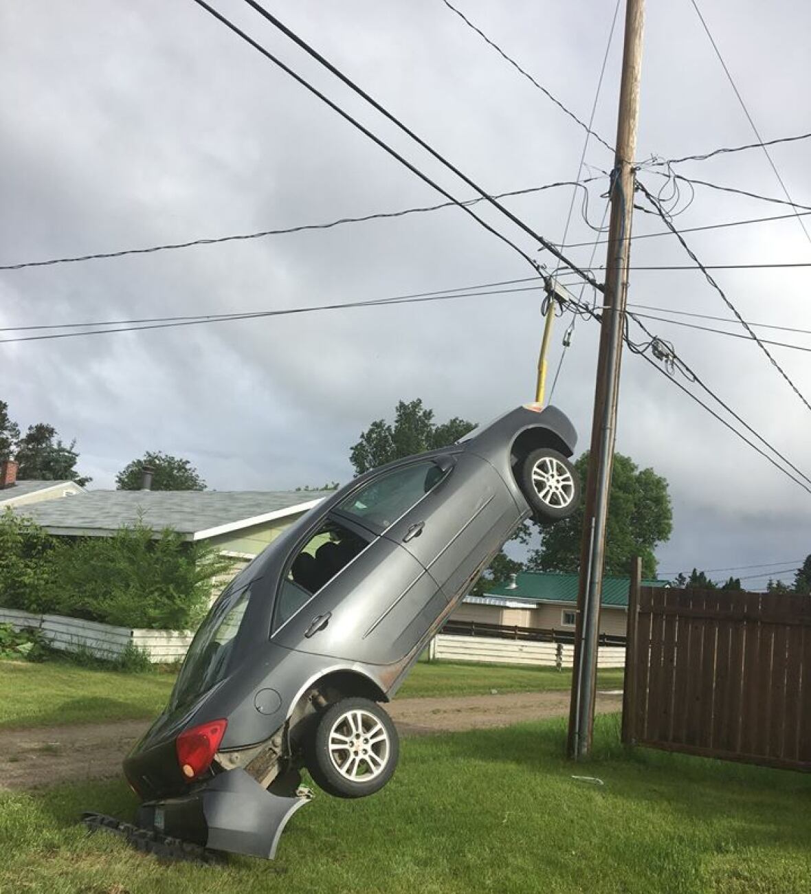 Dangling car removed from power pole cables in Nipawin, Sask. CBC News