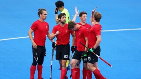 Teammates celebrate Scott Tupper scoring his sides sixth goal during the 5th-8th place match between Canada and China on day eight of the Hero Hockey World League Semifinal at Lee Valley Hockey and Tennis Centre on Saturday in London, England. canada-mens-field-hockey-062417-620