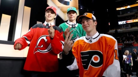 Nico Hischier, Miro Heiskanen, and Nolan Patrick pose for photos after being selected during the 2017 NHL Draft at the United Center on Friday in Chicago. nhl-draft-062317-620