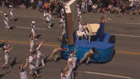 This float was pushed by four black high school students and some people in the crowd posted photos and videos of it with allegations of racism. parade float racist