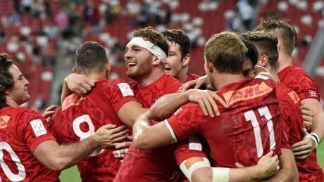 Canada, pictured above after a victory in the Cup final of a tournament in Singapore in April, rallied to draw even with the United States in a Rugby World Cup qualifier match. canada-rugby