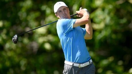 Jordan Spieth watches his tee shot on the 12th hole during the first round of the Travelers Championship golf tournament on Thursday. He maintained his lead through the third day of competition on Saturday. spieth-jordan