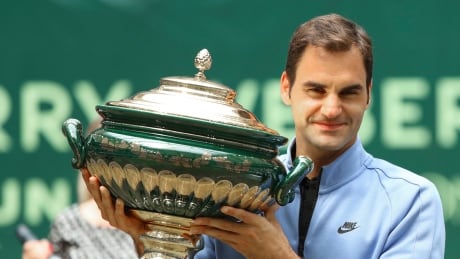 Switzerland's Roger Federer celebrates his victory after the final match against Germany's Alexander Zverev at the Gerry Weber Open tennis tournament in Halle, Germany, Sunday. Germany Tennis Gerry Weber Open
