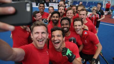 Members of the Canadian men's team celebrate their World Cup qualification with a selfie after defeating India to secure 5th place at the field hockey World League semifinals on Sunday in London, England. canada-mens-field-hockey-062517-620