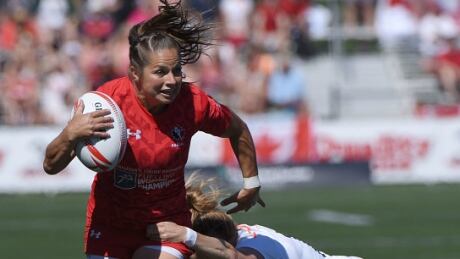 Canada's Ashley Steacy, pictured above against England at the HSBC Canada women's sevens rugby event in May, ended her international career with a bronze medal on Sunday in France. steacy-ashley