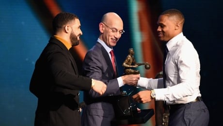 Russell Westbrook, right, received the MVP trophy on Monday from NBA commissioner Adam Silver, middle, and Drake, left. westbrook-russell-062717