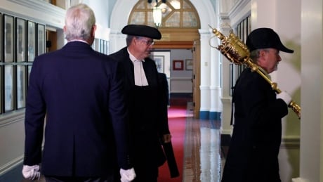 Newly appointed Speaker Steve Thomson is led by the sergeant-at-arms to start the throne speech debate in Victoria, B.C., on Monday, June 26, 2017. BC Legislature 20170626