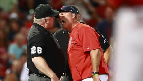 Red Sox manager John Farrell, right, was suspended one game for poking umpire Bill Miller, left, in the chest. farrell-john-062717
