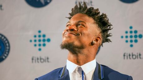 Minnesota Timberwolves new point guard Jimmy Butler smiles at fans during a press conference at Mall of America in Bloomington, Minn., on Thursday. Timberwolves Butler Pressconference