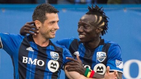 Blerim Dzemaili, left, of the Impact celebrates with teammate Dominic Oduro after scoring during Monteal's 2-0 win over D.C. United, on Saturday. Dzemaili-Blerim-01072017