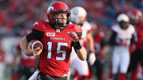 Calgary Stampeders' Andrew Buckley (15) runs for a touchdown in second half of a gameagainst the Ottawa Redblacks. redblacks-stampeders