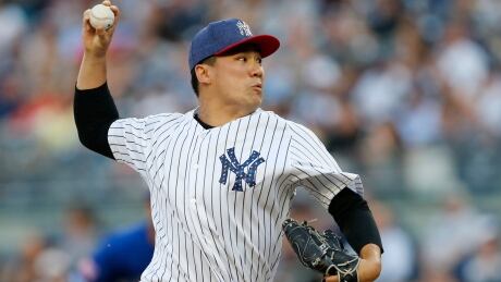 New York Yankees starting pitcher Masahiro Tanaka delivers during the first inning of a game against the Toronto Blue Jays on Monday. jays-yankees
