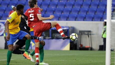 Dejan Jakovic (5) scores against French Guiana during Canada's 4-2 win in its opening game of the CONCACAF Gold Cup Friday in New Jersey. Gold Cup Canada French Guiana Soccer