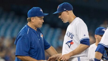 Blue Jays manager John Gibbons, left, relieves starting pitcher Aaron Sanchez after he surrendered eight runs in less than two innings in a 12-2 rout by the Houston Astros. Jays-Astros-07072017