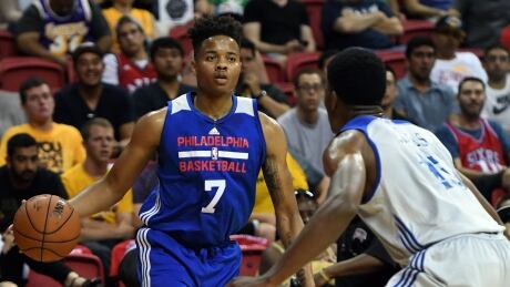 Philadelphia 76ers guard Markelle Fultz, left, appeared to roll his ankle during a summer league game on Saturday and had to be helped to the locker room by teammates. fultz-markelle-070817-620