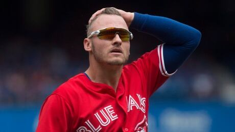 Toronto Blue Jays third baseman Josh Donaldson makes his way back to the dug out at the end of first inning against the Houston Astros in Toronto on Sunday. donaldson-josh-070917-620