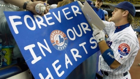 In this Sept. 29, 2004, file photo, Montreal Expos first baseman Brad Wilkerson signs autographs before the team's final home game against the Florida Marlins in Montreal. montreal-expos