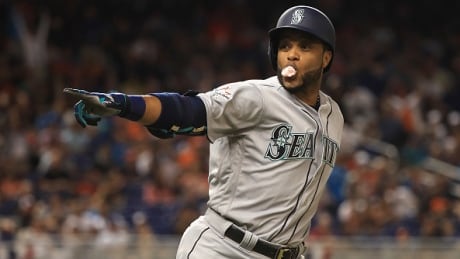 Seattle Mariner's Robinson Cano and the American League celebrates hitting a home run in the tenth inning against the National League during the 88th MLB All-Star Game at Marlins Park. cano-robinson