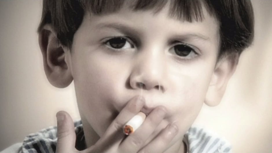In this screen capture from Maria Marshall's film "When I Grow Up I Want To Be A Cooker," a young child is seen smoking.