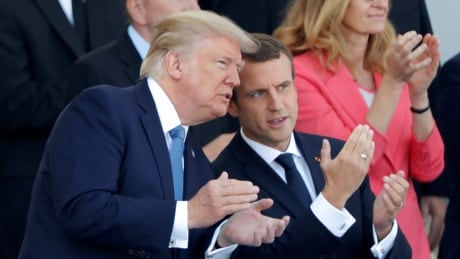 French President Emmanuel Macron and U.S. President Donald Trump attend the traditional Bastille Day military parade on the Champs-Elysees in Paris, France, July 14, 2017. FRANCE-USA/