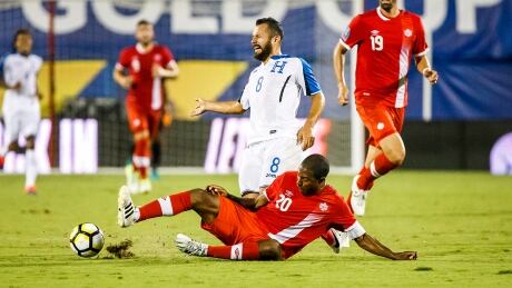 Patrice Bernier makes a slide tackle on Alfredo Mejia of Honduras during Canada's 0-0 draw in CONCACAF Gold Cup action in Frisco, Texas, on Friday. Canada-Honduras-14072017