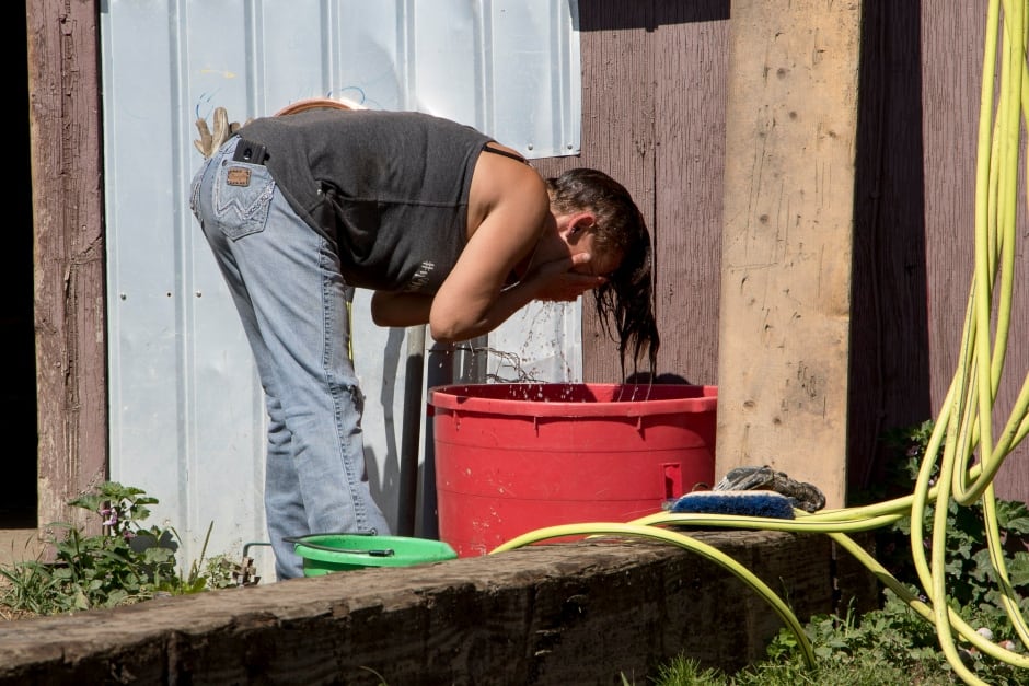 BC Wildfire Evacuees cool down with water