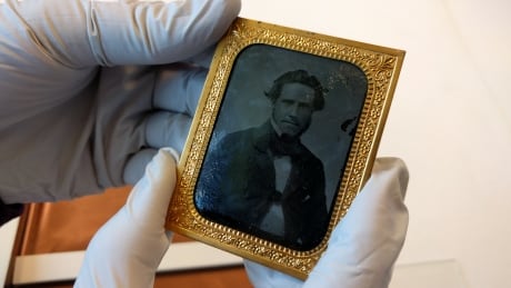 Passafiume was working to catalogue early photographs printed on metal or glass when she came across the panotype from the 19th century. Panotypes are a rare find, as the leather and image deteriorates over time. Library and Archives Preservation Centre panotype