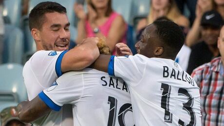Montreal Impact's Michael Salazar (19) is smothered by teammates after scoring against the Philadelphia Union in Montreal's 2-1 win Wednesday. SOC MLS Union Impact 20170719