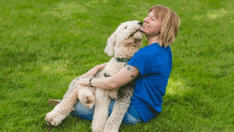 Bridgett vonHoldt, an assistant professor in ecology and evolutionary biology at Princeton and the study’s lead co-author, cuddles with her Old English Sheepdog, Marla.
Photo byChris Fascenelli, Office of Communications Bridgett vonHoldt