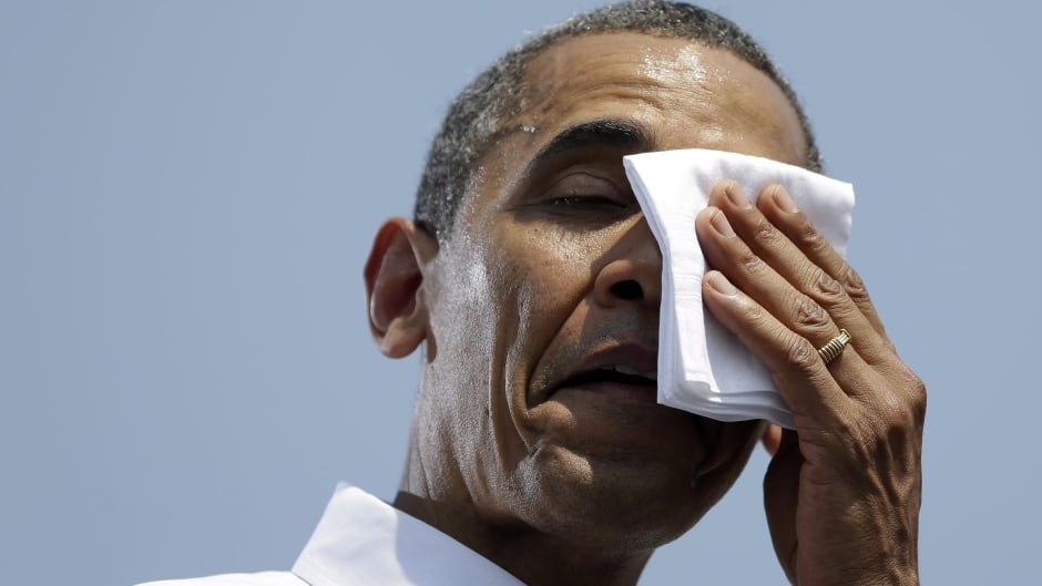 Even Presidents get overheated. President Barack Obama wipes sweat from his face during a campaign event at Iowa State University, Tuesday, Aug. 28, 2012, in Ames, Iowa. (AP Photo/Pablo Martinez Monsivais)