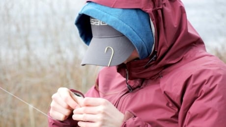 Grade 12 student Erin Sketchley ties a fly to the end of her line at a fly fishing camp led by Campbell river high school teacher Nicolas Pistrerzi. Technical knots are a fundamental skill for any angler. Fly tying