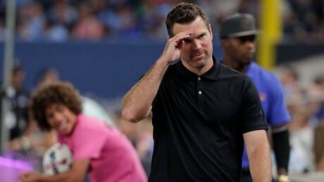 Toronto FC head coach Greg Vanney makes a saluting gesture to fans as he walks off the field after receiving a red card during FC's 2-2 draw in New York on Wednesday. MLS Toronto FC NYC FC Soccer