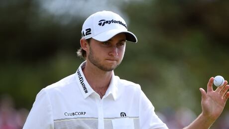 Canada's Austin Connelly retreives his ball in the third round of the British Open Golf Championships on Saturday. Connelly-Austin-22072017