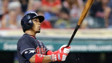 Cleveland Indians' Francisco Lindor watches his solo home run off Toronto Blue Jays relief pitcher Danny Barnes in the 10th inning. jays-indians