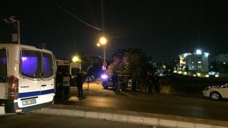 Security officials park near the approach toward the Israeli embassy in Amman, Jordan, on Sunday, June 23, 2017, in the aftermath of a shooting that left a Jordanian man dead and an Israeli man wounded. A security official confirmed a Jordanian had been killed and an Israeli wounded, but would not provide further details. He spoke on condition of anonymity because he was not authorized to discuss the incident with the media. Jordan-Israeli Embassy