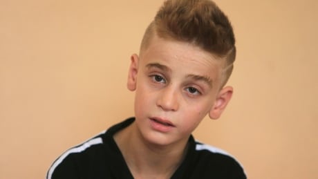 A Yazidi boy, twelve year-old Imad Tammo rescued from Islamic State militants by the Iraqi army, speaks during an interview with Reuters in Sina neighbourhood outside of Duhok, Iraq July 25, 2017. REUTERS/Ari Jalal - RTX3CVE3 MIDEAST-CRISIS/IRAQ-YAZIDIBOY