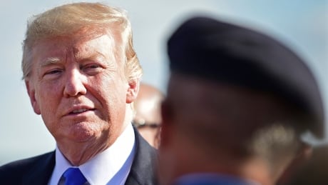 President Donald Trump listens to a Air Force Airmen at the Youngstown-Warren Regional Airport, Tuesday, Tuesday, July 25, 2017, in Vienna, Ohio. Trump will be speaking at a rally Tuesday at the Covelli Centre in Youngstown, Ohio. Trump Ohio