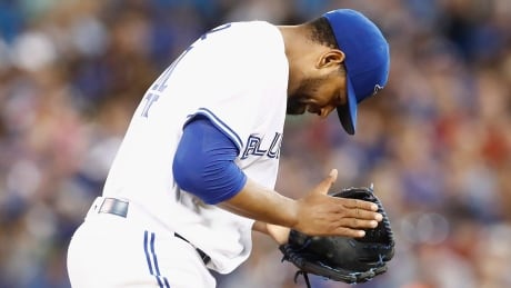 Toronto Blue Jays starting pitcher Cesar Valdez reacts after a strikeout during the sixth inning against the Oakland Athletics. athletics-blue-jays