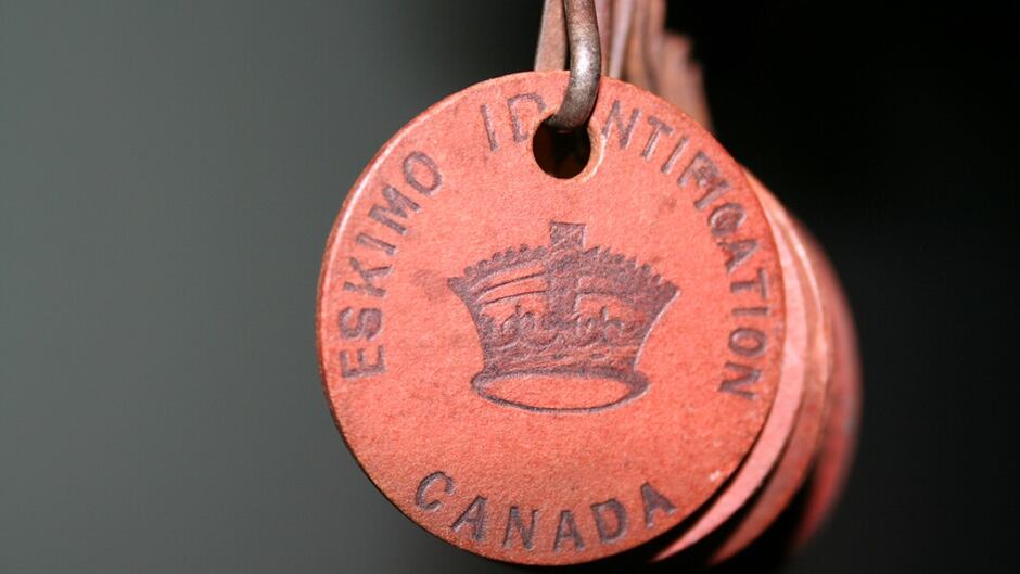 From the 1940s until the 1970s, Inuit people in the Canadian Arctic were forced to wear tags like this one, photographed by Inuit artist Barry Pottle in 2009.