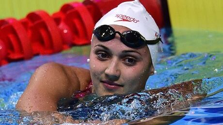 Canada's Kylie Jacqueline Masse celebrates a new world record after the women's 100m backstroke final during the swimming competition at the 2017 FINA World Championships in Budapest, on July 25, 2017. / AFP PHOTO / Martin BUREAU (Photo credit should read MARTIN BUREAU/AFP/Getty Images) masse-kylie-170725-1180