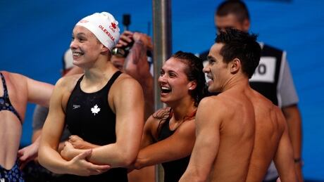 Team Canada celebrates winning the bronze medal during the mixed 4x100-metre medley relay final at the FINA world championships on July 26, 2017 in Budapest, Hungary. canada-swimming
