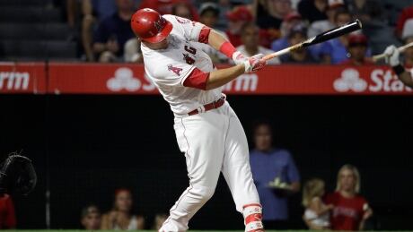 Los Angeles Angels' Mike Trout hits a double, the 1000th hit of his career, during the fourth inning. trout-mike