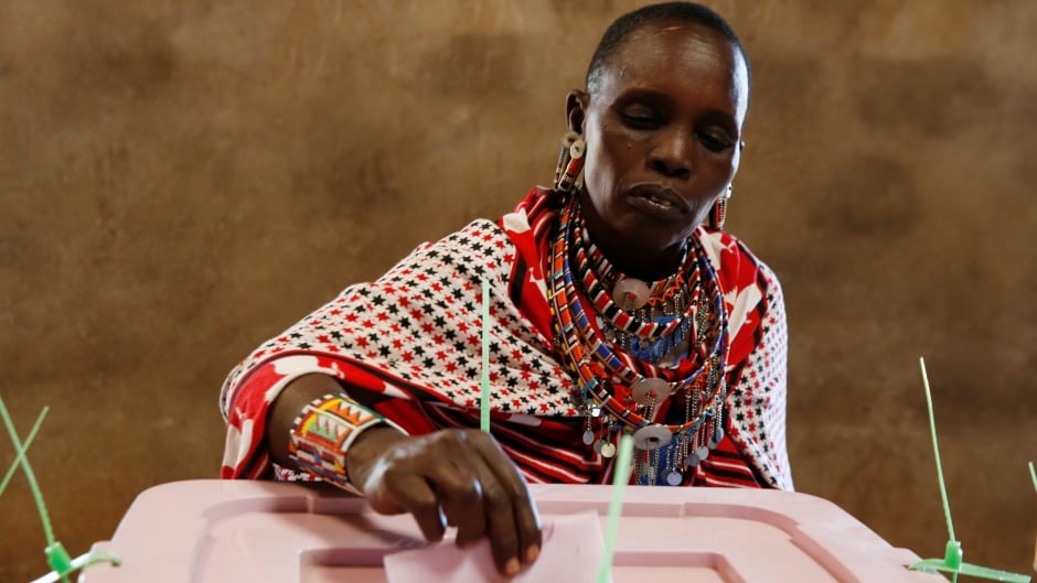 A Maasai tribeswoman votes during the presidential election in Kisamis, Kenya, Aug. 8, 2017. Around 19 million people are registered to vote in the country.